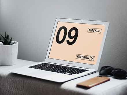 free-macbook-air-on-table-mockup-(psd)